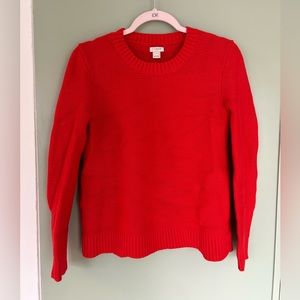 Bright tomato red J Crew crew neck sweater.